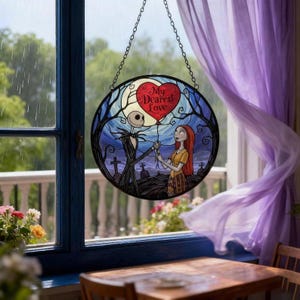 May include: A round stained glass window hanging with a chain. The image depicts Jack Skellington and Sally from The Nightmare Before Christmas holding a heart-shaped balloon with the text "My Dearest Love". The background is a moonlit graveyard.