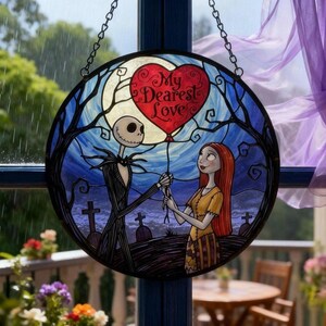 May include: Round stained glass window art featuring Jack Skellington and Sally from The Nightmare Before Christmas. Jack holds a red heart-shaped balloon with "My Dearest Love" text. The background shows a graveyard, full moon, and blue sky.