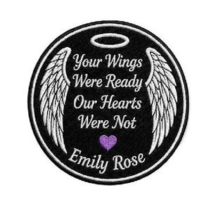 May include: A black embroidered patch with white angel wings and the text "Your Wings Were Ready Our Hearts Were Not" and the name "Emily Rose" in white. A purple heart is in the center.