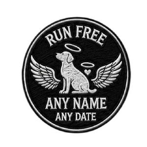 May include: A black and white embroidered patch with a dog angel design. The patch features a dog with a halo and wings, with the words "RUN FREE" at the top and "ANY NAME ANY DATE" at the bottom.