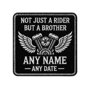 May include: A black and white patch featuring the text "NOT JUST A RIDER BUT A BROTHER" above a motorcycle engine design with wings. The text "ANY NAME - ANY DATE -" is below the engine.