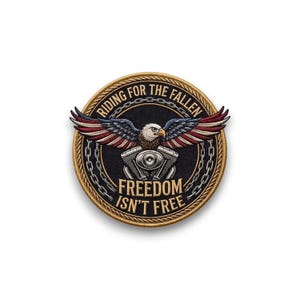 May include: Embroidered patch featuring an eagle with outstretched wings, colored in red, white, and blue. The patch has the text "RIDING FOR THE FALLEN" and "FREEDOM ISN'T FREE" in a circular design, with a motorcycle engine graphic.