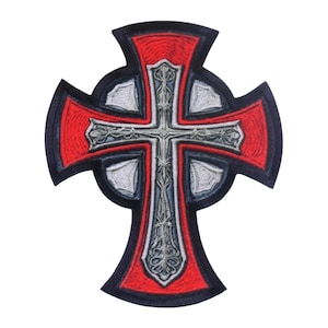 May include: An embroidered patch in the shape of a Celtic cross. The design features a central silver cross with intricate filigree details, set against a background of vibrant red segments and a black border that outlines the entire cross shape.