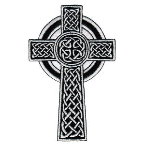 May include: A black and white embroidered patch featuring a Celtic cross design. The cross is adorned with intricate, repeating knotwork patterns throughout its vertical and horizontal arms, centered within a circular ring element.