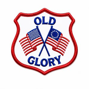 May include: A shield-shaped embroidered patch with a white background and a red border. It features two crossed flags, one a modern American flag and the other a historical flag with a circle of stars, with the blue text OLD GLORY above and below.