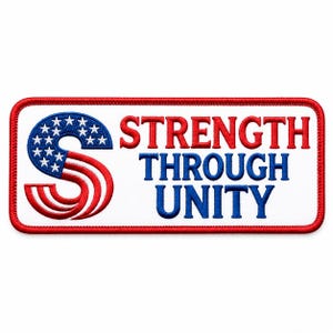 May include: A rectangular embroidered patch with a white background and a red border. On the left, a stylised letter S features a blue field with white stars and red and white stripes. The text STRENGTH THROUGH UNITY is embroidered in red and blue.