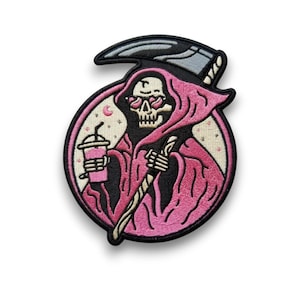 May include: Embroidered patch featuring a cartoon Grim Reaper in a pink robe and sunglasses with heart-shaped lenses. The Reaper holds a pink drink and a scythe. The patch is surrounded by a black border and a pink circle.
