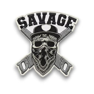 May include: Embroidered patch featuring a skull wearing a bandana and a hat, with crossed saws behind it. The word "SAVAGE" is arched above the skull in bold, black letters. The patch has a white border.