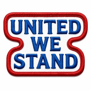 May include: A rectangular embroidered patch with rounded corners and a red stitched border. The white background features the blue embroidered text UNITED WE STAND arranged in three lines, with the words stacked vertically in a bold font.