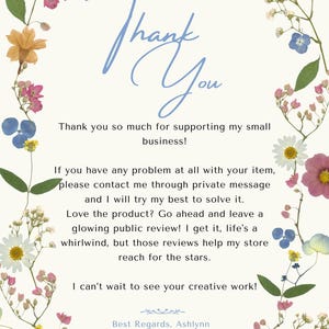 May include: A cream-colored card with the words "Thank You" in blue script, surrounded by a floral border of dried flowers in shades of pink, yellow, and blue. Text below expresses gratitude and encourages reviews.