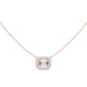 May include: A rose gold necklace featuring a central emerald-cut clear gemstone surrounded by a halo of small round white stones. The pendant is suspended from a delicate rose gold chain with small, uniform oval links, creating a refined look.