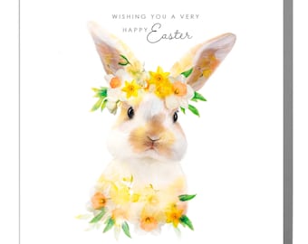 May include: A white bunny with brown ears wearing a yellow flower crown. The bunny is surrounded by yellow flowers and green leaves. The text "Wishing you a very Happy Easter" is written above the bunny.