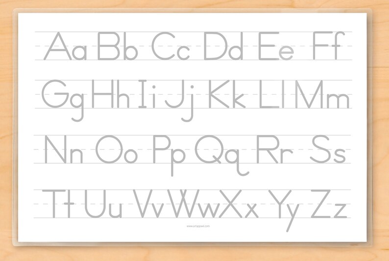 Reverse side of place mat with clear laminate. Upper and lower case grey alphabet letters on white ground.