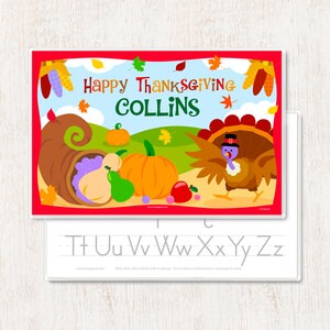 May include: A colorful Thanksgiving-themed wipe-clean placemat with a turkey, cornucopia, pumpkins, and grapes. The placemat has the text "Happy Thanksgiving Collins" and a line of letters for tracing: Tt Uu Vv Ww Xx Yy Zz.
