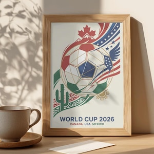 Może przedstawiać: Oprawiony plakat z motywem piłki nożnej, zawierający elementy w kolorach czerwonym, białym i niebieskim oraz kaktus. Tekst "WORLD CUP 2026 CANADA USA MEXICO" jest wyświetlany poniżej. Rama wykonana jest z jasnobrązowego drewna.