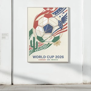 Może przedstawiać: Oprawiony plakat na Mistrzostwa Świata 2026, z motywem piłki nożnej w kolorach czerwonym, białym i niebieskim. Plakat zawiera napis "WORLD CUP 2026 CANADA USA MEXICO" oraz grafikę kaktusa.
