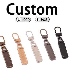 May include: Five metal zipper pulls in various colors: bronze, copper, silver, gunmetal, and black. The word "Custom" is above the pulls, with options for "L Logo" and "T Text".