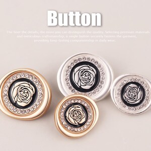 May include: Four round buttons featuring a central black inlay with a silver rose relief, surrounded by a ring of clear crystals. Two buttons have a gold-tone finish and two have a silver-tone finish. The word Button is printed at the top.