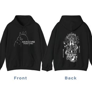 May include: Black hoodie with a white illustration of a Studio Ghibli character on the front. The back of the hoodie has a detailed white graphic with characters and text. The text "STUDIO GHIBLI" is visible. A hooded sweatshirt.