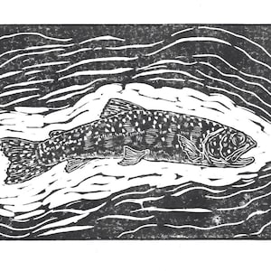 May include: Black and white woodcut print of a trout swimming in a stream. The fish is detailed with spots and fins, and the water is depicted with wavy lines.