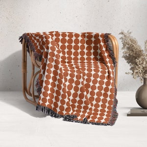 Terracotta dots on soft white background woven blanket.