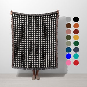 Black geometric dots on natural white background blanket with fringed edges. Organic cotton woven throw blanket.