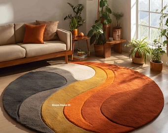 Alfombra redonda abstracta moderna en tonos óxido y mostaza / Alfombra circular con diseño de ondas esculpidas para sala de estar