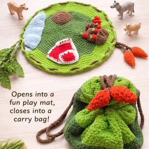 May include: A green crochet play mat bag with a farm theme. The mat features a green field, a blue pond, and red and white barn. The bag closes into a carry bag with orange carrot accents. The text says "Crochet Farm Play Mat Bag".
