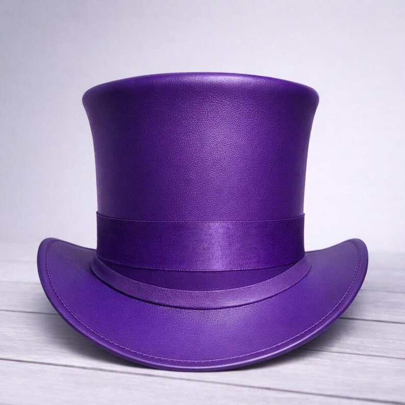 May include: A vibrant purple top hat with a matching band encircling the crown. The hat features a wide brim and a smooth, polished finish. This formal hat is suitable for costume parties or theatrical performances.