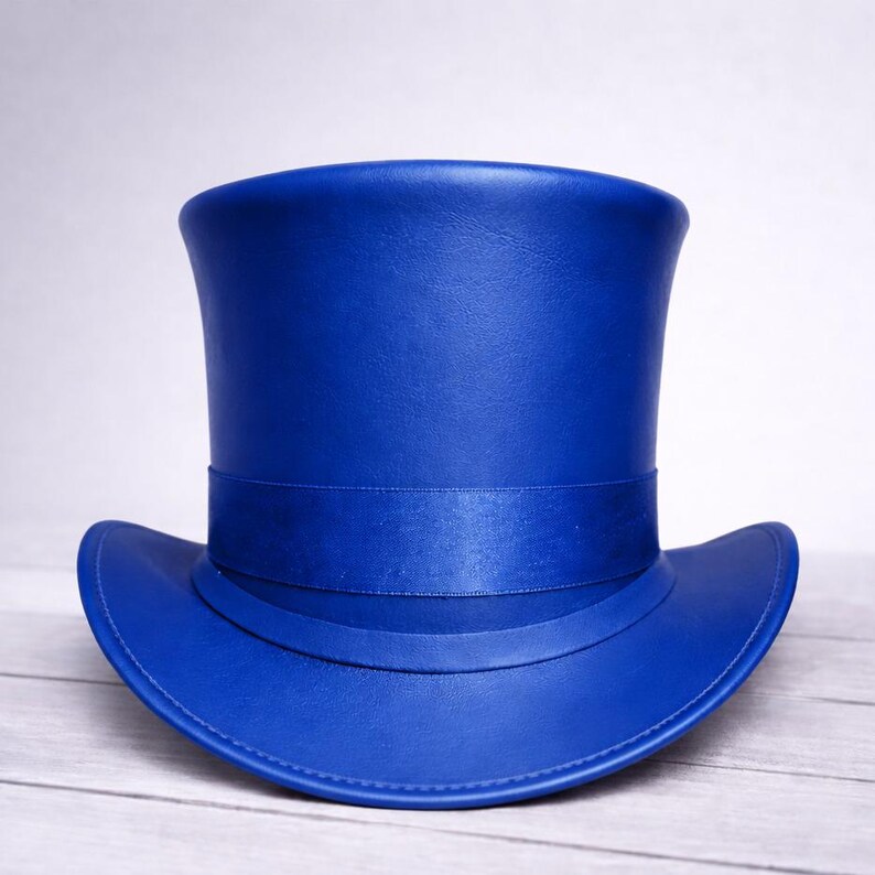 May include: A vibrant blue top hat with a satin band. The hat has a classic tall crown and a wide brim. The hat is made of a smooth material and is a striking accessory.