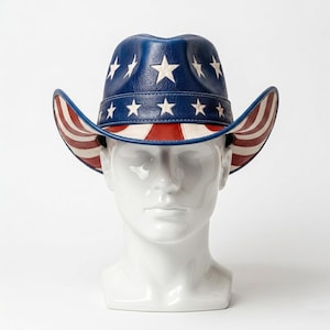May include: A patriotic cowboy hat with a blue crown adorned with white stars. The brim features red and white stripes, and the hat is displayed on a white mannequin head. This hat is a festive accessory.