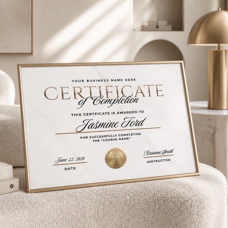 May include: A framed certificate of completion with gold lettering and a gold border. The certificate is awarded to Jasmine Ford and dated June 22, 2026. The text includes "Your Business Name Here" and "For Successfully Completing the 'Course Name'".