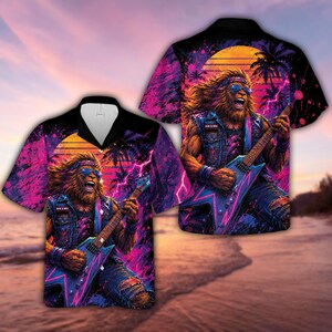 May include: A short-sleeve button-down shirt featuring a vibrant graphic print of a long-haired creature playing a blue electric guitar. The design includes neon pink and purple lightning, palm trees, a sunset, and the text Rock & Roll.