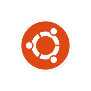May include: A circular sticker featuring the orange Ubuntu logo, which consists of a solid orange background with a white graphic of three stylised figures connected by a central ring, each with a circular head, arranged in a circular pattern.