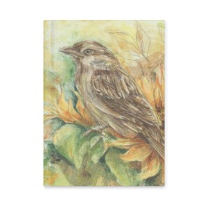 May include: A rectangular canvas print featuring a detailed illustration of a brown sparrow perched among large yellow sunflower petals and green leaves. The artwork uses soft, blended strokes to depict the bird and floral elements.