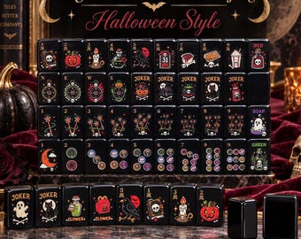 May include: A set of black Mahjong tiles featuring engraved Halloween-themed illustrations including pumpkins, skulls, ghosts, and potions. The tiles are arranged in rows and columns, displaying numbers, directional symbols, and the text Engraved American Mahjong Halloween Style.