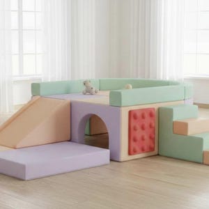 A multi-colored soft play complex for children in pastel colors with a slide and tunnel