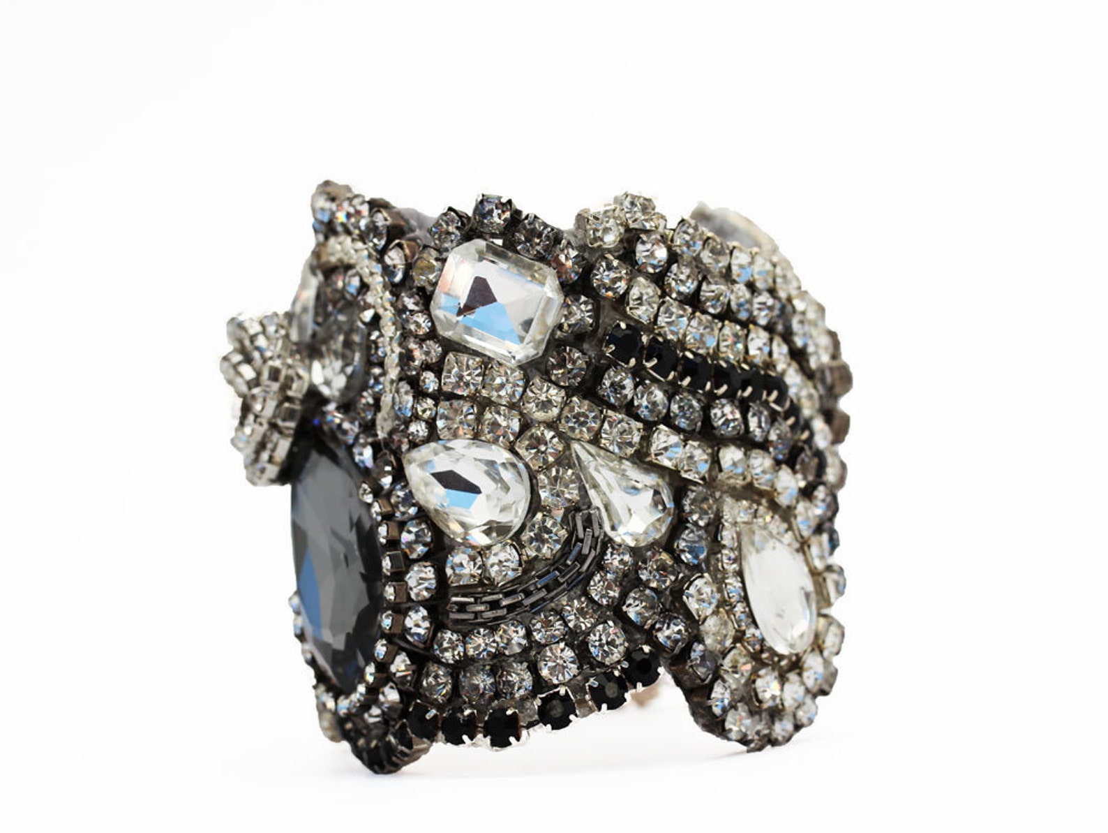 Side view of rhinestone cuff showing dimensional vintage crystal design and texture