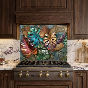 May include: A decorative kitchen backsplash featuring a vibrant botanical design. The artwork showcases large, colorful leaves in shades of red, teal, gold, and green. The backsplash is installed above a stainless steel gas range with brass knobs.