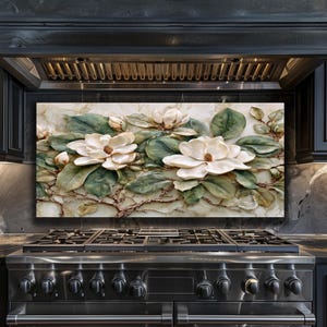 May include: A decorative kitchen backsplash featuring a 3D relief of magnolia flowers. The flowers are creamy white with brown centers, surrounded by green leaves and brown branches, set against a marble-like background.