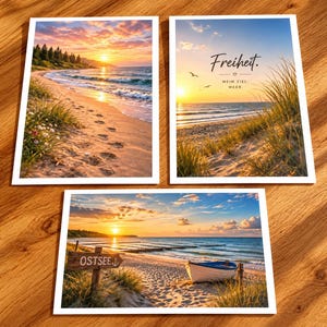 May include: Three rectangular postcards featuring coastal sunset scenes. One shows a sandy beach with footprints, another displays dunes with the text "Freiheit. MEIN ZIEL: MEER.", and the third depicts a wooden sign reading "OSTSEE" near a small boat.