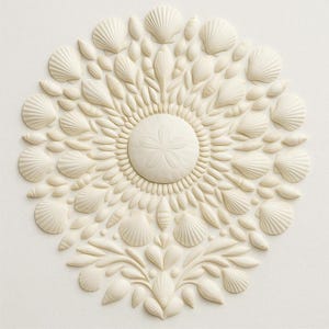 May include: A circular, off-white seashell arrangement. The design features various shell types, including scallop and conch shells, arranged around a central sand dollar. The composition has a floral-like appearance, with detailed textures and a natural aesthetic.