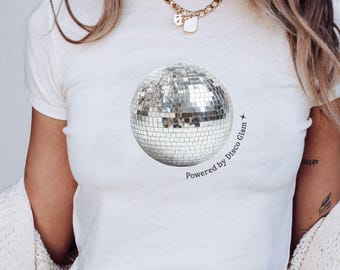 Powered By Disco Glam Baby Tee, Retro Mirror Ball Shirt for Women, 70s Dance Party Top, Trendy Y2K Going Out Fitted T-Shirt