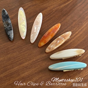 May include: An assortment of oval hair clips and barrettes in shades of black, white, orange, and blue, displayed on a wooden surface. The image includes the text "Hair Clips & Barrettes".