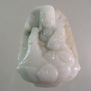 Carved Kwan Yin Jadeite Pendant ..... Lot 5445