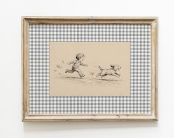 May include: A framed illustration featuring a black and white ink drawing of a child running alongside a small dog on a tan background. The artwork is set against a blue and white gingham matting and enclosed in a light-toned wooden frame.