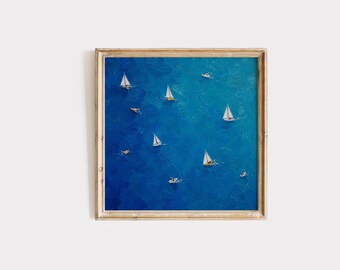 May include: A square framed oil painting depicting an aerial view of a deep blue ocean with several white sailboats and small yellow watercraft scattered across the textured surface, captured in a vibrant palette of varying shades of blue.