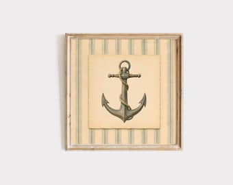 May include: Framed nautical art print featuring a detailed illustration of an anchor wrapped with rope. The anchor is set against a parchment-style background, framed by a striped pattern in beige and green, within a wooden frame.