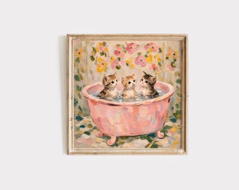May include: A framed painting depicts three kittens in a pink bathtub filled with water. The kittens have brown and black markings. The background features a floral design with pink, yellow, and green hues. The artwork has a vintage aesthetic.
