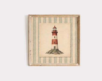 May include: Framed artwork featuring a lighthouse illustration. The lighthouse is red and white, set against a beige background with a distressed edge. The frame has a striped pattern with a light wood finish, creating a vintage aesthetic.